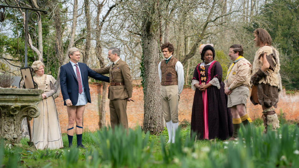 The Ghosts cast standing in the garden in Ghosts season 4