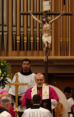 The acting Latin Patriarch of Jerusalem Pierbattista Pizzaballa leads a mass at the Church of the Nativity on Christmas eve, in Bethlehem, in the Israeli-occupied West Bank December 24, 2018. REUTERS/Mussa Qawasma