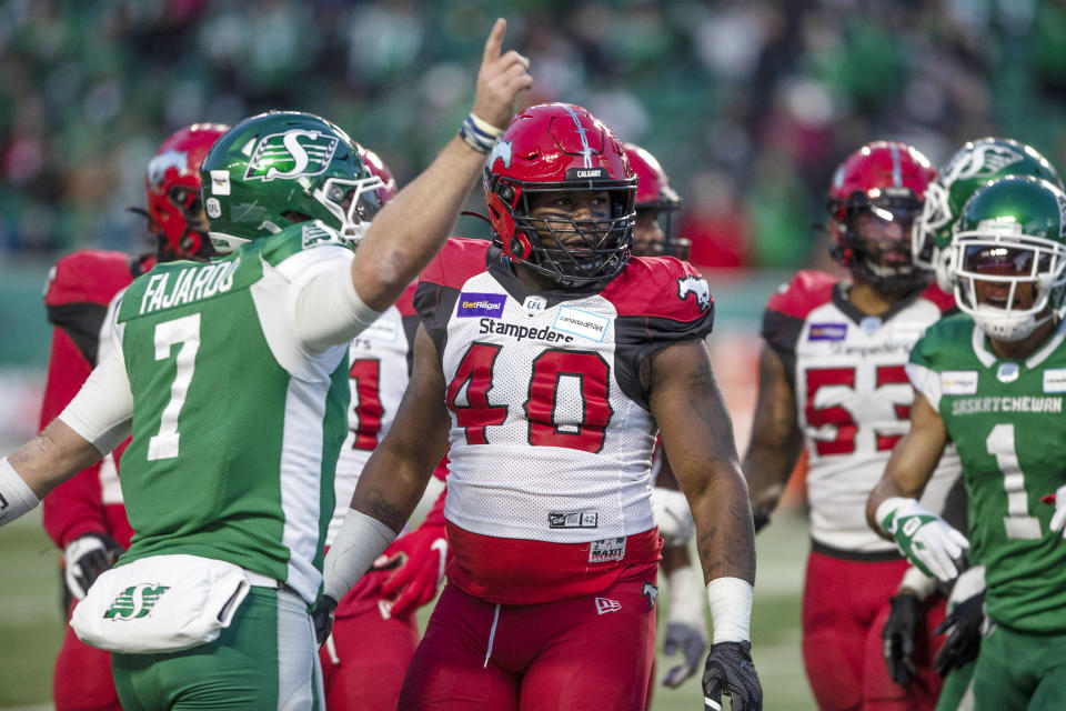 Calgary Stampeders defensive lineman Shawn Lemon (40) looks on moments before getting ejected from the game after throwing a punch during the first half of a CFL football game against the Saskatchewan Roughriders Sunday, Nov. 28, 2021 in Regina, Saskatchewan. (Kayle Neis/The Canadian Press via AP)