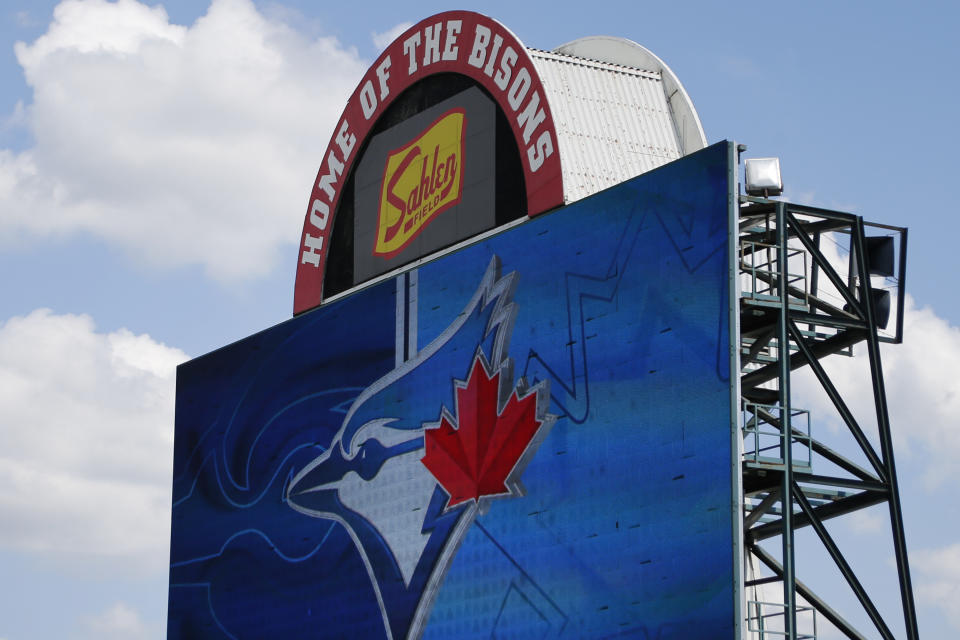 FILE - In this July 24, 2020, file photo, signage at Sahlen Field, home of the Toronto Blue Jays' Triple-A affiliate, in Buffalo, N.Y., is viewed. The Blue Jays will walk onto the field Tuesday, Aug. 11, 2020, as the host team for the first time in 2020. (AP Photo/Jeffrey T. Barnes, File)