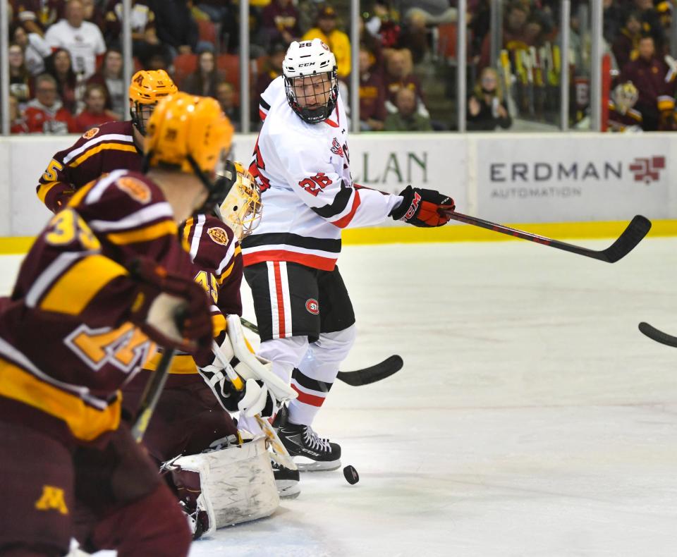 St. Cloud State's Easton Brodzinski watches the puck bounce in front of the University of Minnesota goal during the game Saturday, Oct. 16, 2021 at the Herb Brooks National Hockey Center in St. Cloud. 