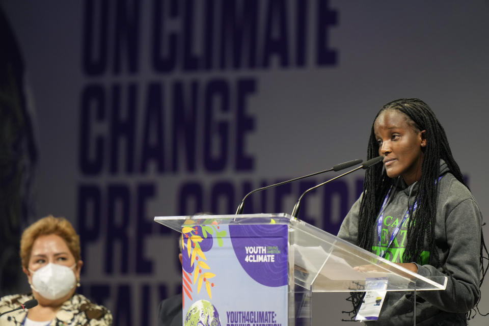 Ugandan climate activist Vanessa Nakate, right, speaks at the start of a three-day Youth for Climate summit in Milan, Italy, Tuesday, Sept. 28, 2021. Sitting at left is Patricia Espinosa, Executive Secretary of the United Nations Framework Convention on Climate Change (UNFCCC). (AP Photo/Luca Bruno)