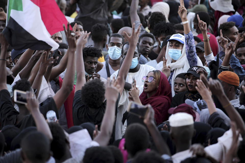 People chant slogans during a protest in Khartoum, Sudan, Saturday, Oct. 30, 2021. Pro-democracy groups called for mass protest marches across the country Saturday to press demands for re-instating a deposed transitional government and releasing senior political figures from detention. (AP Photo/Marwan Ali)