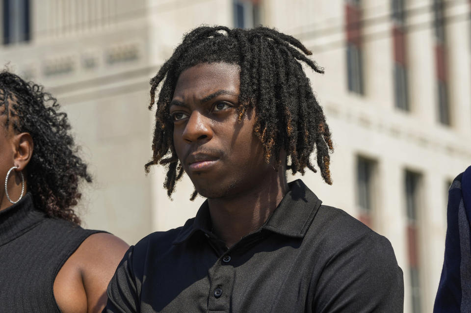 Darryl George, 18, stands next to his mother, Darresha George in front of Galveston County Court House on Thursday, May 23, 2024, in Galveston, Texas. A hearing was set to be held Thursday in a federal lawsuit a George filed against his Texas school district over his punishment for refusing to change his hairstyle. (Raquel Natalicchio/Houston Chronicle via AP)