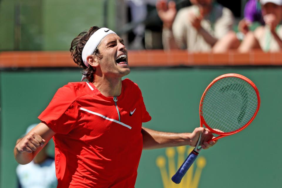 American Taylor Fritz reacts after defeating Alex de Minaur of Australia in three sets at the BNP Paribas Open in Indian Wells, Calif., on Wednesday, March 16, 2022. 