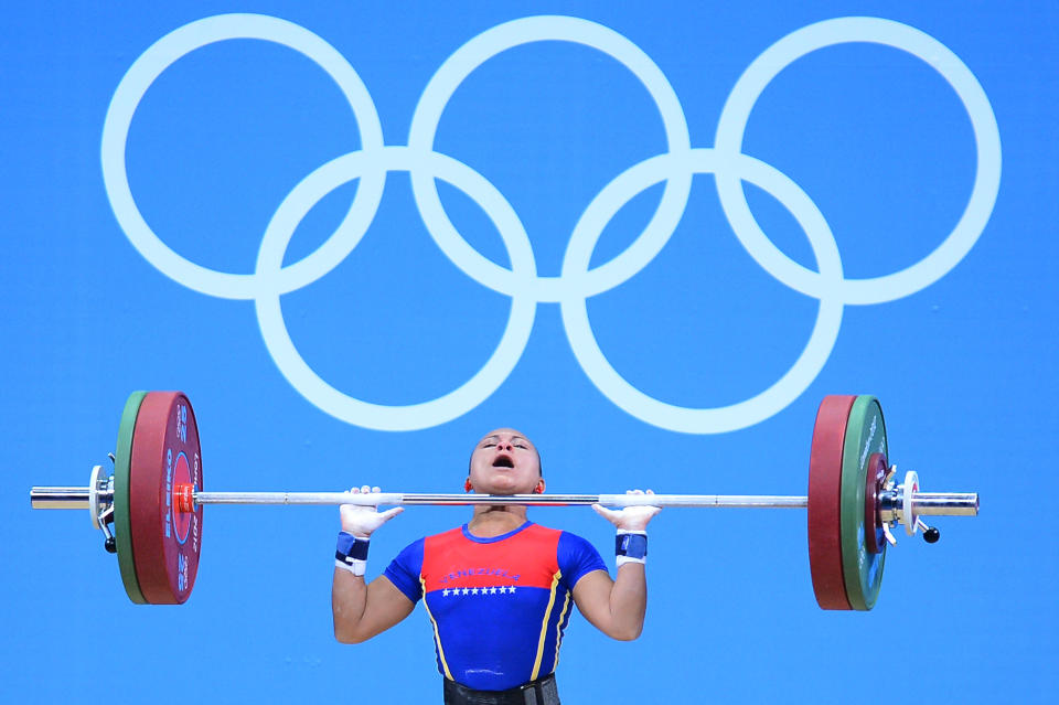 LONDON, ENGLAND - JULY 28: Betsi Gabriela Rivas Arteaga of Venezuela competes in the Women's 48kg Group A weightlifting on Day 1 of the London 2012 Olympic Games at ExCeL on July 28, 2012 in London, England. (Photo by Laurence Griffiths/Getty Images)