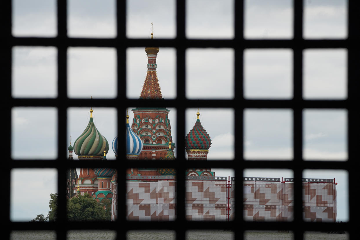 A view of the Kremlin from behind a gate.