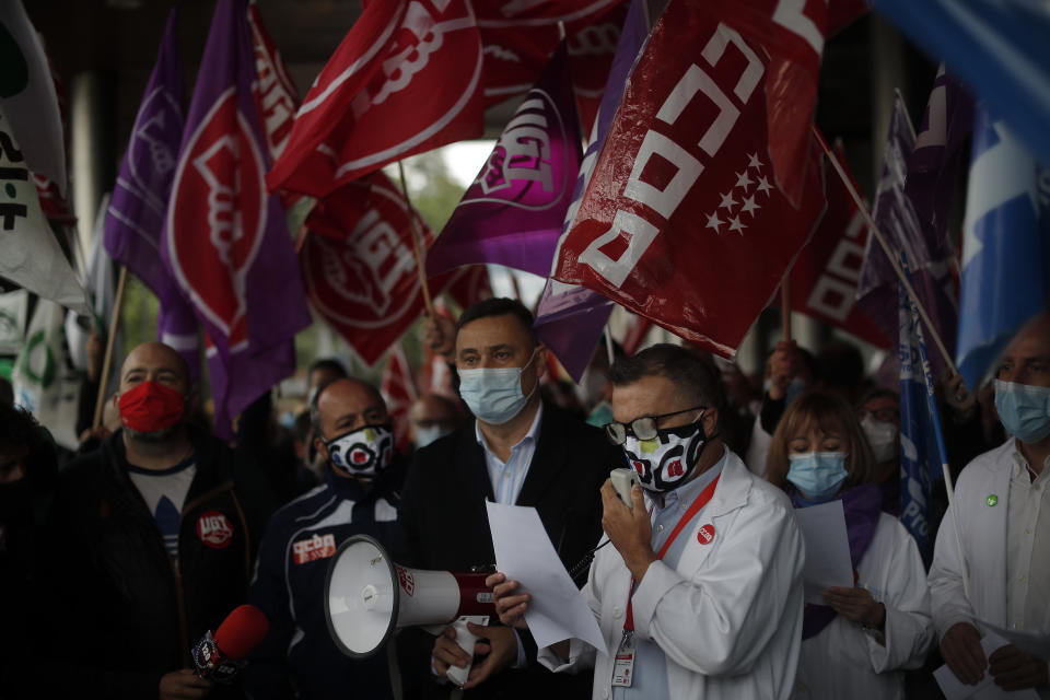 MADRID, SPAIN - OCTOBER 20: Spanish healthcare workers take part in a protest against work conditions, getting heavier due to coronavirus (COVID-19) pandemic, and privatization in the health sector outside the Ramon y Cajal State Hospital in Madrid, Spain on October 20, 2020. (Burak Akbulut/Anadolu Agency via Getty Images)