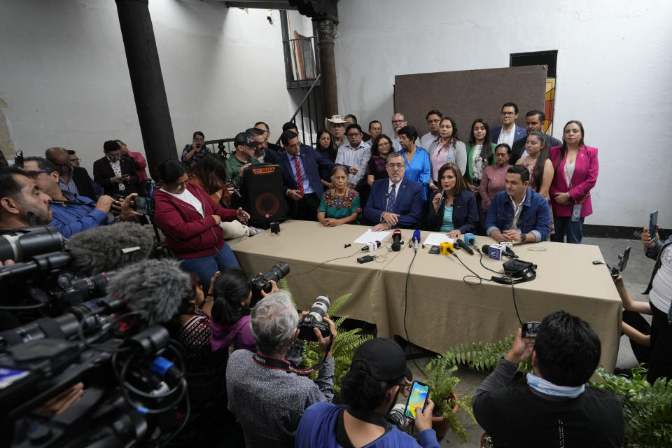 Bernardo Arévalo and his running mate Karin Herrera, the presidential ticket with the Seed Movement party, give a press conference in Guatemala City, Thursday, July 13, 2023. On Wednesday, the Attorney General's Office announced that a judge had suspended the legal status of the Seed Movement party, for alleged violations when it gathered the necessary signatures to form. Arévalo and Herrera had been set to compete in a runoff election on Aug. 20. (AP Photo/Moises Castillo)