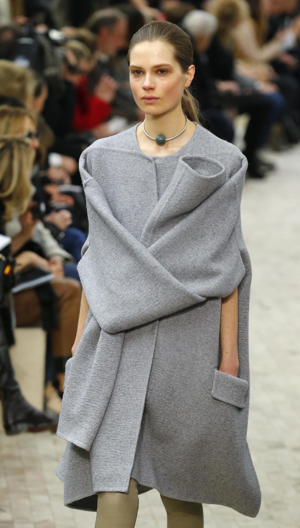 A model presents a creation for Celine's Ready to Wear Fall-Winter 2013-2014 fashion collection, presented Sunday, March 3, 2013 in Paris. (AP Photo/Jacques Brinon)