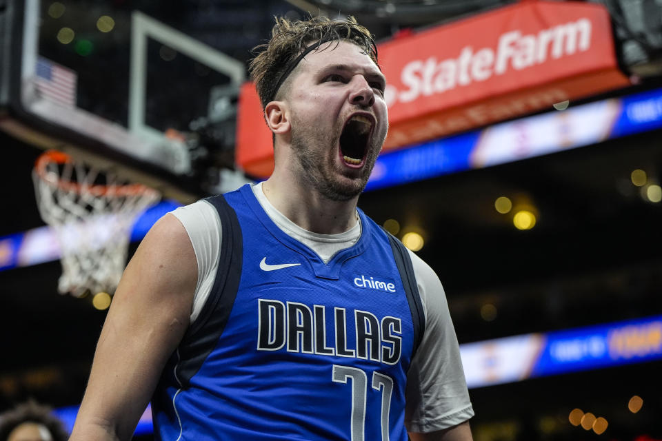 Dallas Mavericks guard Luka Doncic (77) celebrates his shot against the Atlanta Hawks during the second half of an NBA basketball game, Friday, Jan. 26, 2024, in Atlanta. Doncic had 73 points on the night. (AP Photo/Mike Stewart)