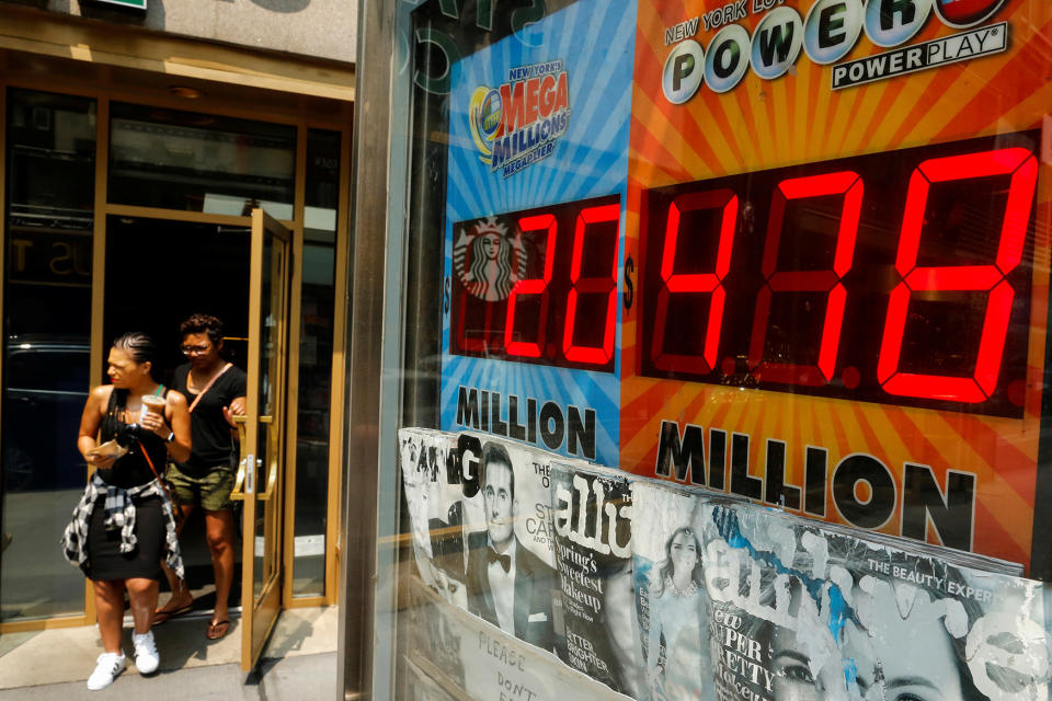 An electronic display shows the Powerball lottery jackpot in New York