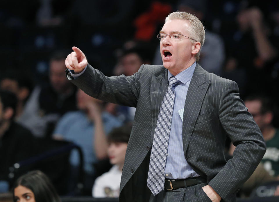 FILE - In this Sunday Feb. 4, 2018 file photo, Milwaukee Bucks interim head coach Joe Prunty yells at his players during the second half of an NBA basketball game against the Brooklyn Nets, Sunday, Feb. 4, 2018, in New York. Joe Prunty will coach USA Basketball in this weekend’s AmeriCup qualifying games in San Juan. Joe Johnson is one of eight players on the team with NBA experience.. (AP Photo/Kathy Willens, File)