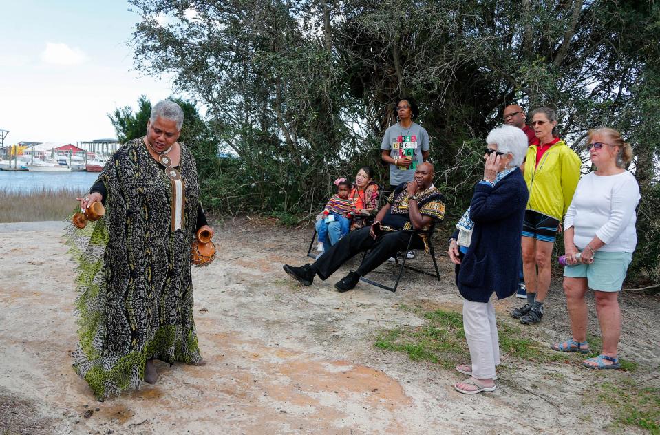 Lillian Grant-Baptiste performs a libation ceremony near the Lazaretto Creek Boat Ramp, honoring the ancestors and those that came before, for the first day of the 34th annual Savannah Black Heritage Festival on Wednesday February 1, 2023.