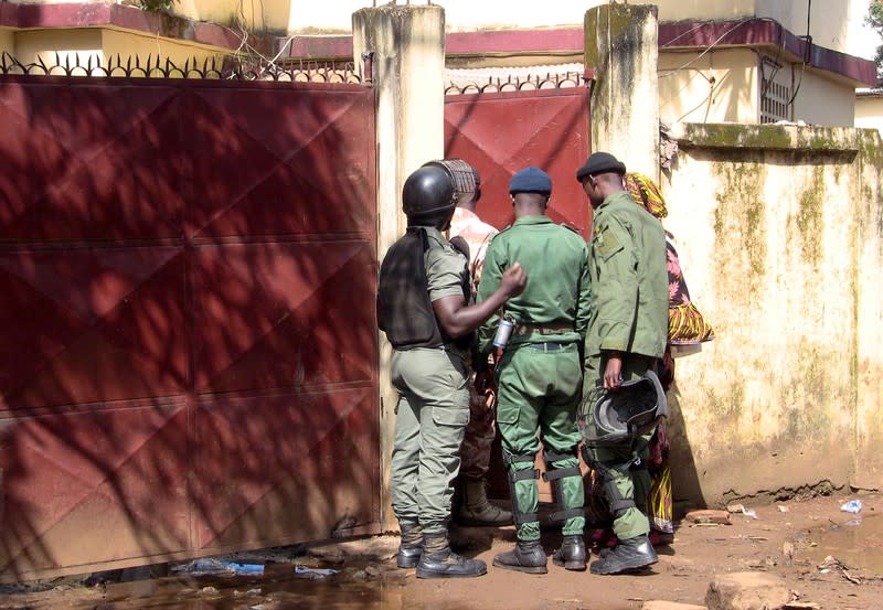 Members of security forces guard the entrance of a court in Conakry