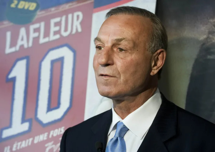 FILE -Hockey legend Guy Lafleur speaks to the media at the official launch of a DVD on his life "IL Etait Une Fois...Guy Lafleur" in Montreal, Monday, Nov. 2, 2009. Hockey Hall of Famer Guy Lafleur, who helped the Montreal Canadiens win five Stanley Cup titles in the 1970s, died Friday, April 22, 2022, at age 70. (AP Photo/The Canadian Press, Graham Hughes, File)