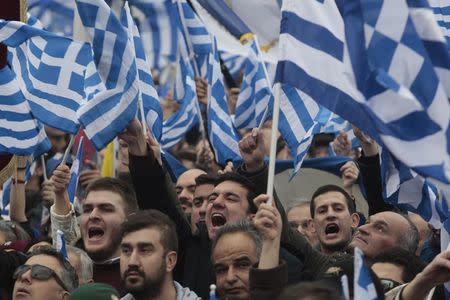 Protesters wave Greek national flags and shout slogans during a rally against the use of the term "Macedonia" in any solution to a dispute between Athens and Skopje over the former Yugoslav republic's name, in the northern city of Thessaloniki, Greece, January 21, 2018. REUTERS/Alexandros Avramidis