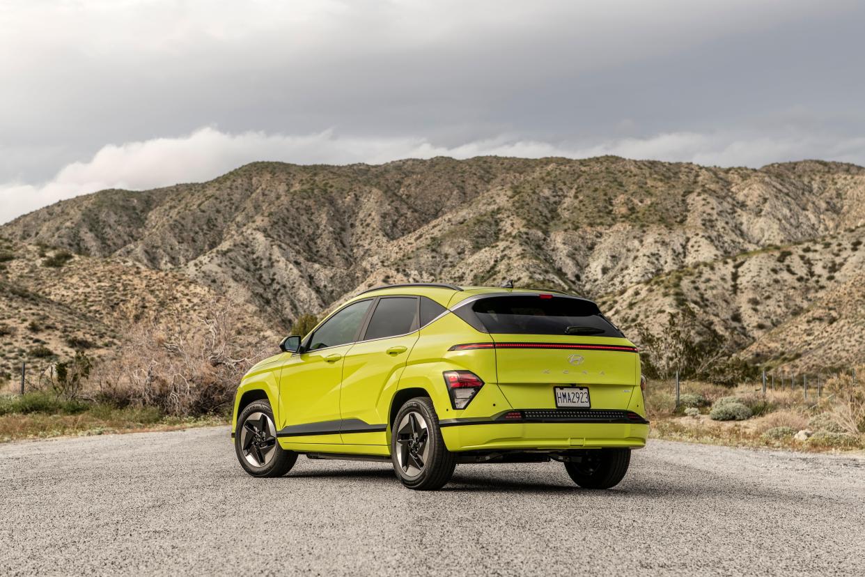 2024 Hyundai Kona Electric parked in front of hills