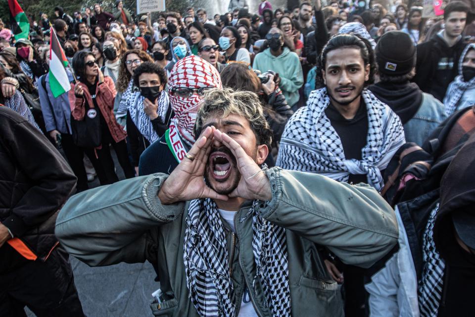 A pro-Palestinian protestor shouts at pro-Israeli protestors as the two sides faced off against each other in Washington Square Park in New York City Oct. 17, 2023. Dozens of New York City police officers created a barrier between the two sides, which numbered well into the hundreds.