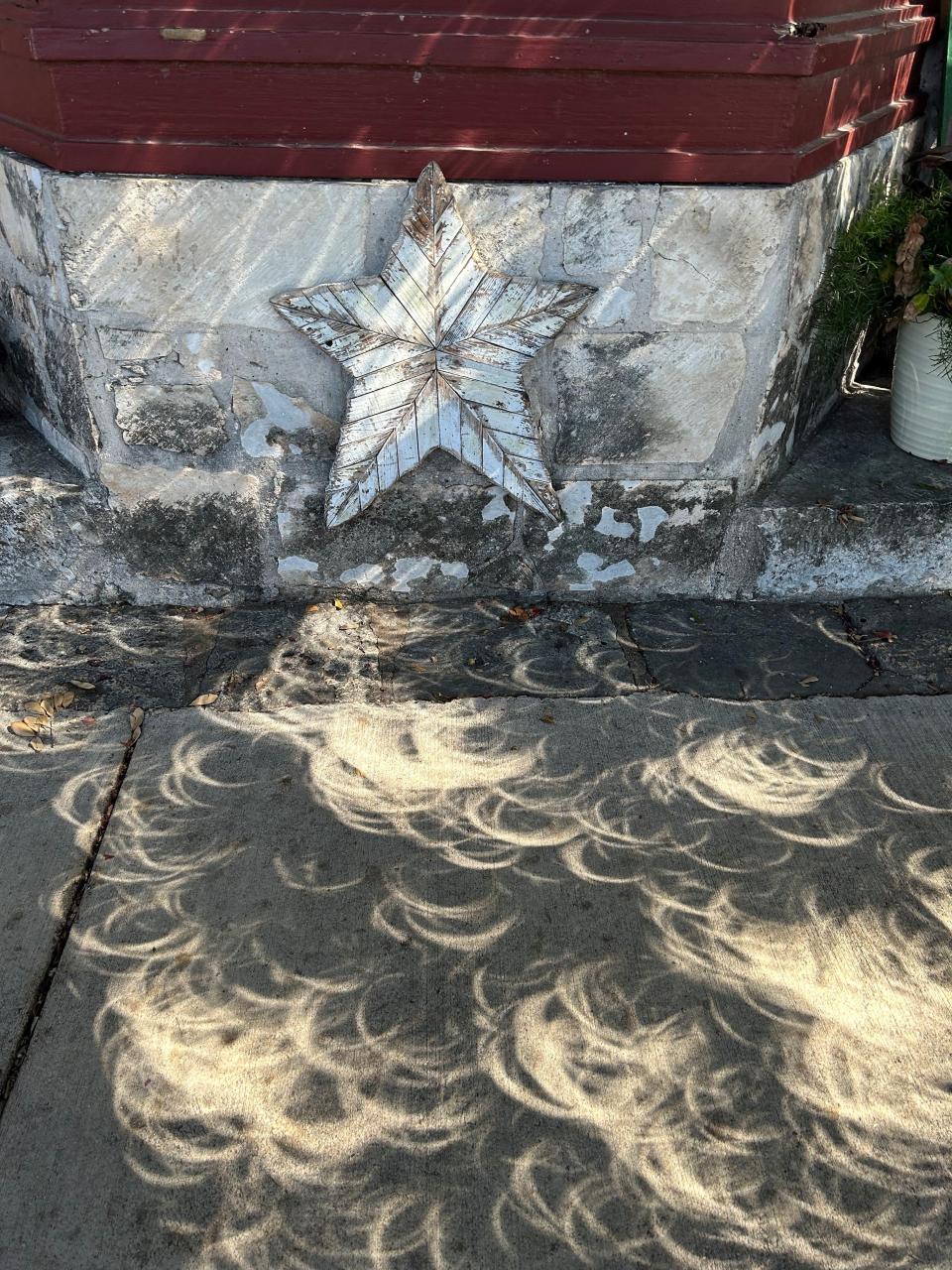 The Oct. 14 lunar eclipse casts interesting shadows on a sidewalk in Fredericksburg, Texas.