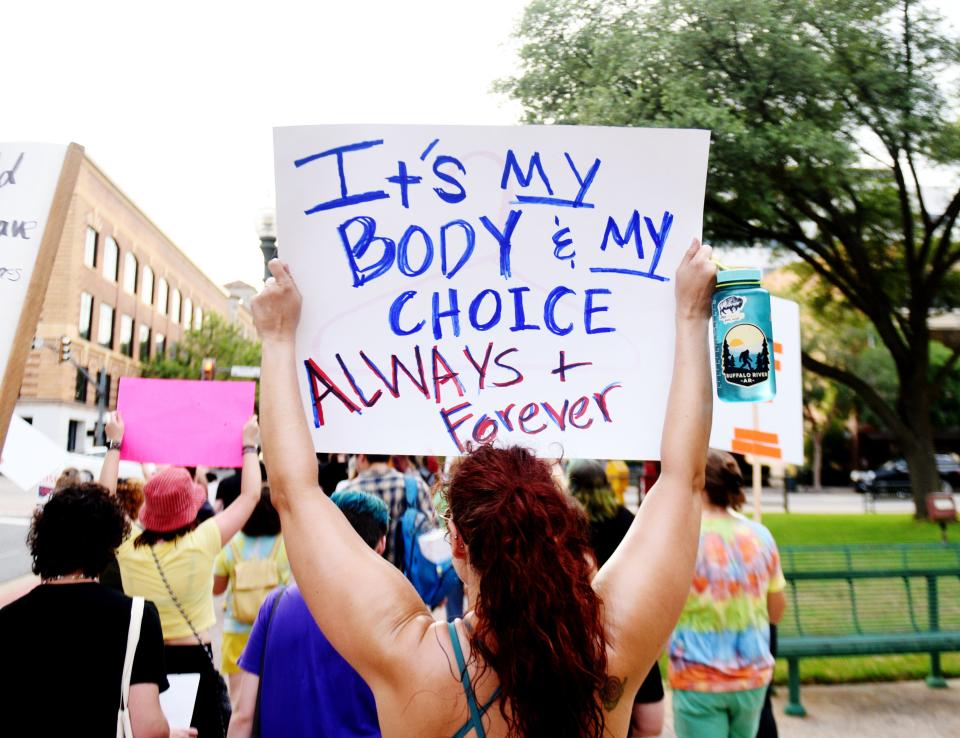 People gathered at the Caddo Parish Courthouse in Shreveport protest the SCOTUS decision to overturn Roe v. Wade Friday evening, June 24, 2022.