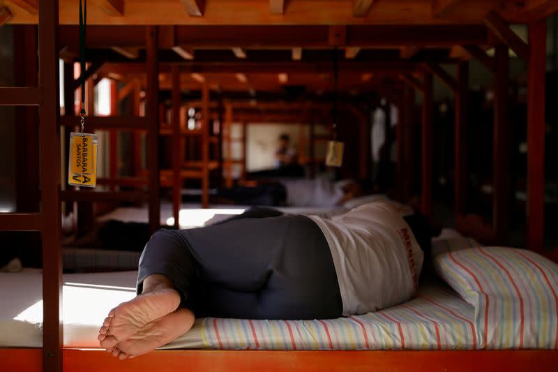 A drug rehab patient takes a nap at the female dormitory of the Mega Drug Abuse Treatment and Rehabilitation Center, in Nueva Ecija province