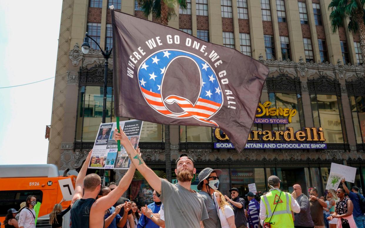 QAnon demonstrators protest child trafficking on Hollywood Boulevard in Los Angeles, California - KYLE GRILLOT /AFP