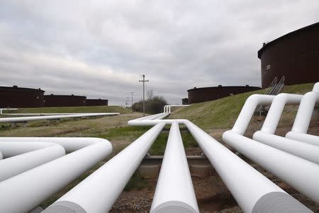 Pipelines run to Enbridge Inc.'s crude oil storage tanks at their tank farm in Cushing, Oklahoma, March 24, 2016. REUTERS/Nick Oxford