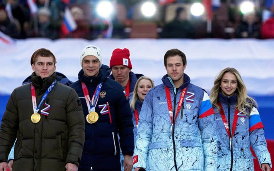 Evgeny Rylov, second left, at the Putin propaganda rally at Moscow's Luzhniki stadium on Friday, March 18, 2022