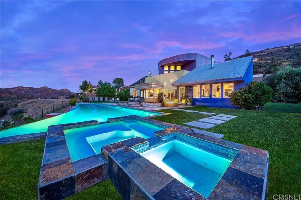 This home for sale in Agoura Hills, California, is located behind private gates with an open floor plan, high ceilings and incredible views. (Redfin)