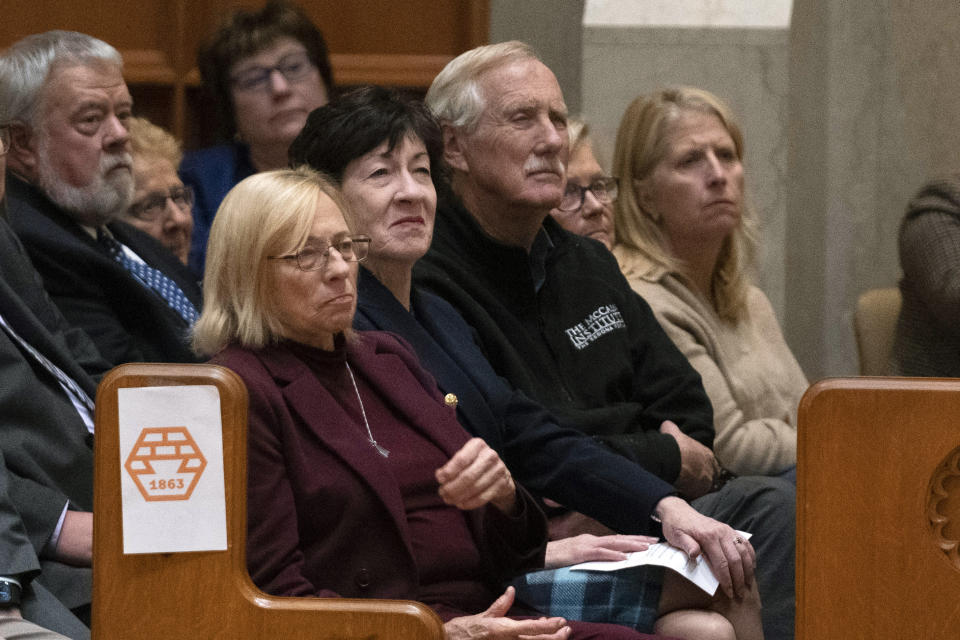 Maine Gov. Janet Mills, front left, and Sens. Susan Collins and Angus King attend a vigil for the victims of mass shootings days earlier, at the Basilica of Saints Peter and Paul, Sunday, Oct. 29, 2023, in Lewiston, Maine. (AP Photo/Robert F. Bukaty)