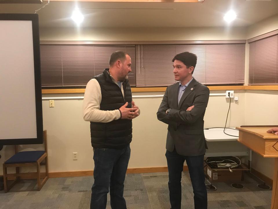 Christian County Board Chairman Bryan Sharp (left) talks with state Sen. Steve McClure, R-Springfield, following town hall in Taylorville on Monday.