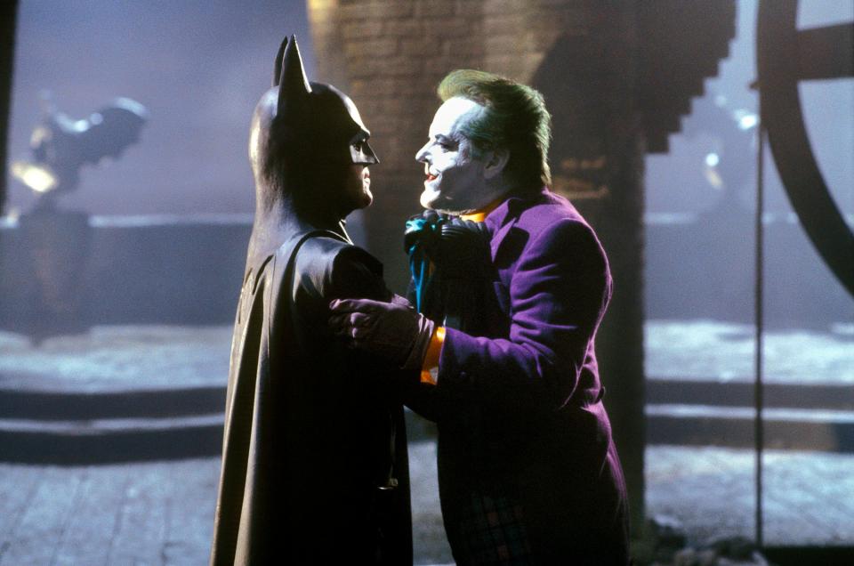 Batman (Michael Keaton, left) and the Joker (Jack Nicholson) throw down in a memorable moment from 1989's "Batman."