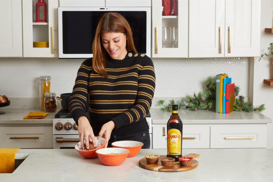 Gail Simmons decorating an espresso martini cup