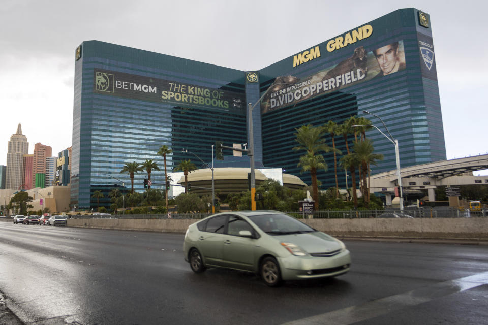 Cars pass the MGM Grand hotel-casino on Wednesday, Sept. 20, 2023, in Las Vegas. MGM Resorts International says computers serving customers at its casino and hotel properties have been restored across the U.S. That’s 10 days after a cyberattack led it to shut down digital systems. (AP Photo/ Ty ONeil)