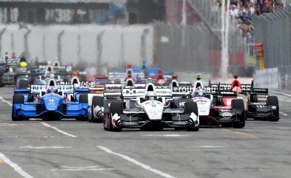 Jul 16, 2017; Toronto, Ontario, CAN; Pole sitter Simon Pagenaud (1) leads the Verizon IndyCar series field on the opening lap during the Honda Indy Toronto at Streets of Toronto.