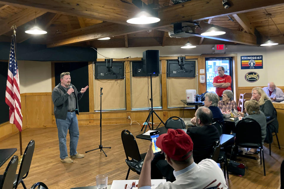 FILE - Republican Secretary of State candidate John Adams, a former state lawmaker and Navy SEAL, speaks to members of the Worthington Area Republican Club at J&D's Place in Worthington, Ohio, March 22, 2022. Former President Donald Trump's attempts to reverse the results of the 2020 election and his subsequent endorsements of candidates for state election offices who are sympathetic to his view have elevated those races to top-tier status. (AP Photo/Julie Carr Smyth, File)