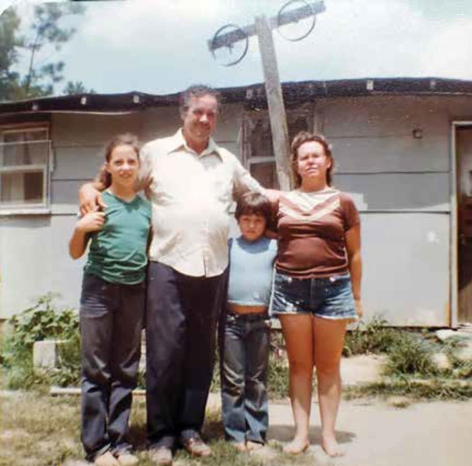 <div class="inline-image__caption"><p>Dinky, Dad, Breland, and Mom in front of our little shack (only nine years since construction, he shack wasn’t holding up well. The bicycle wheels were used for a TV antenna for the rare times we had electricity).</p></div> <div class="inline-image__credit">Courtesy of Pegasus Books</div>