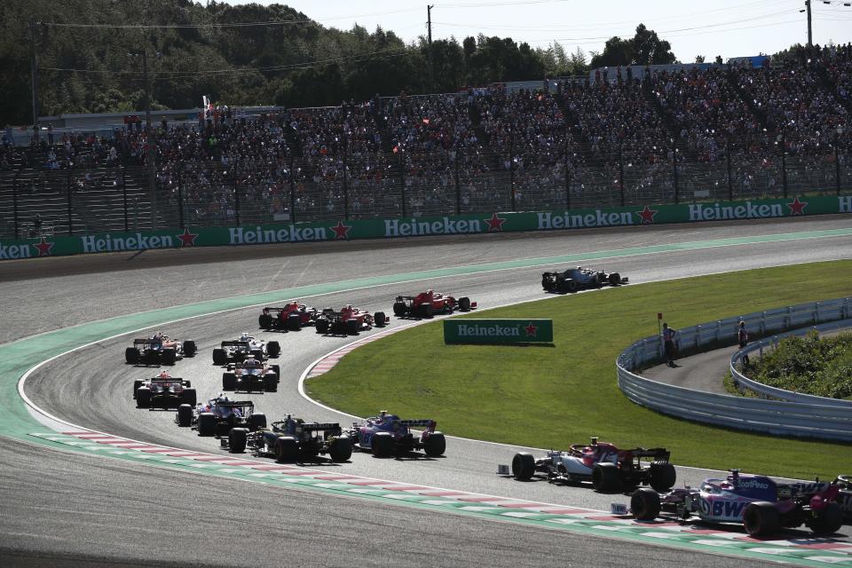 Drivers take a turn during the Formula One Japanese Grand Prix final at Suzuka on October 13, 2019. (Photo by Behrouz MEHRI / AFP) (Photo by BEHROUZ MEHRI/AFP via Getty Images)