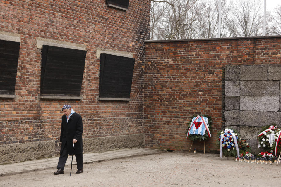 Holocaust survivor Stanislaw Zalewski attends a wreath lying ceremony in front of the Death Wall in the former Nazi German concentration and extermination camp Auschwitz during ceremonies marking the 78th anniversary of the liberation of the camp in Oswiecim, Poland, Friday, Jan. 27, 2023. (AP Photo/Michal Dyjuk)