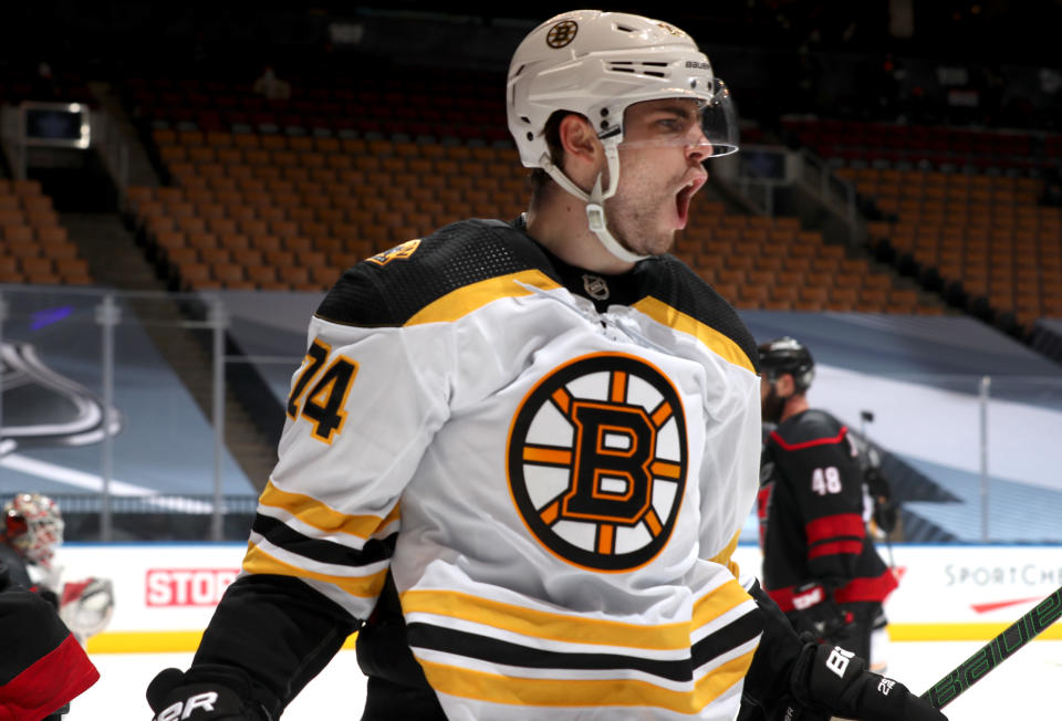 TORONTO, ONTARIO - AUGUST 17: Jake DeBrusk #74 of the Boston Bruins celebrates his second goal against the Carolina Hurricanes with teammates during the third period of Game Four of the Eastern Conference First Round during the 2020 NHL Stanley Cup Playoffs  at Scotiabank Arena on August 17, 2020 in Toronto, Ontario. (Photo by Chase Agnello-Dean/NHLI via Getty Images)