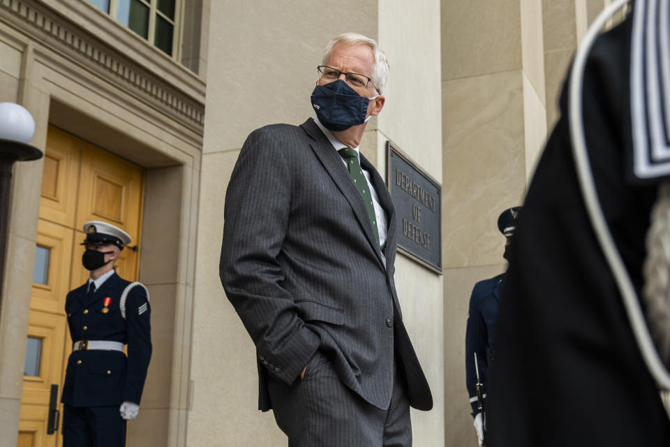 FILE - In this Nov. 13, 2020, file photo Acting Secretary of Defense Christopher Miller walks down the steps at the Pentagon during a ceremony welcoming in Washington. The Pentagon said in a statement that Miller, on Monday, Nov. 30, accepted the resignation of Christopher Maier, who had provided policy oversight of the military's counter-IS effort since March 2017. (AP Photo/Manuel Balce Ceneta, File)