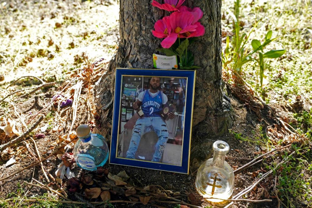 A memorial for Christopher Roberts Jr., who was killed in a 2020 shooting in the parking lot of a Safeway store in Seattle’s Rainier Beach neighborhood, is shown Tuesday, July 12, 2022 near where the shooting took place. (AP Photo/Ted S. Warren)
