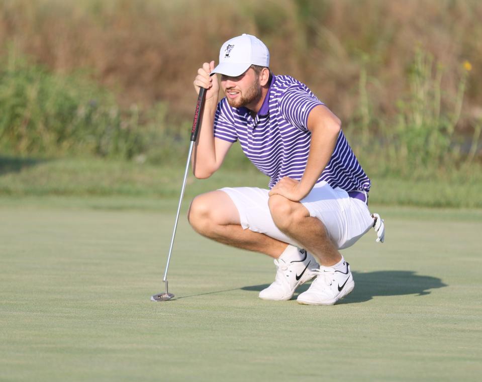 Kansas State senior golfer Tim Tillmanns looks over a putt. Tillmans and the Wildcat men's golf team received a postseason bid for the second straight year on Wednesday.