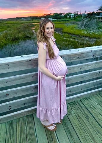 <p>Courtesy of Haley Hodge</p> Haley Hodge posing with her baby bump