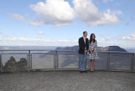 Britain's Prince William and his wife Kate, the Duchess of Cambridge pose for a photo at Echo Point Lookout in Katoomba, Australia, Thursday, April 17, 2014. The Duke and Duchess of Cambridge on Thursday stopped in the Blue Mountains town of Winmalee to meet with firefighters and locals affected by last year's wildfires that destroyed more than 200 homes. (AP Photo/Rob Griffith)