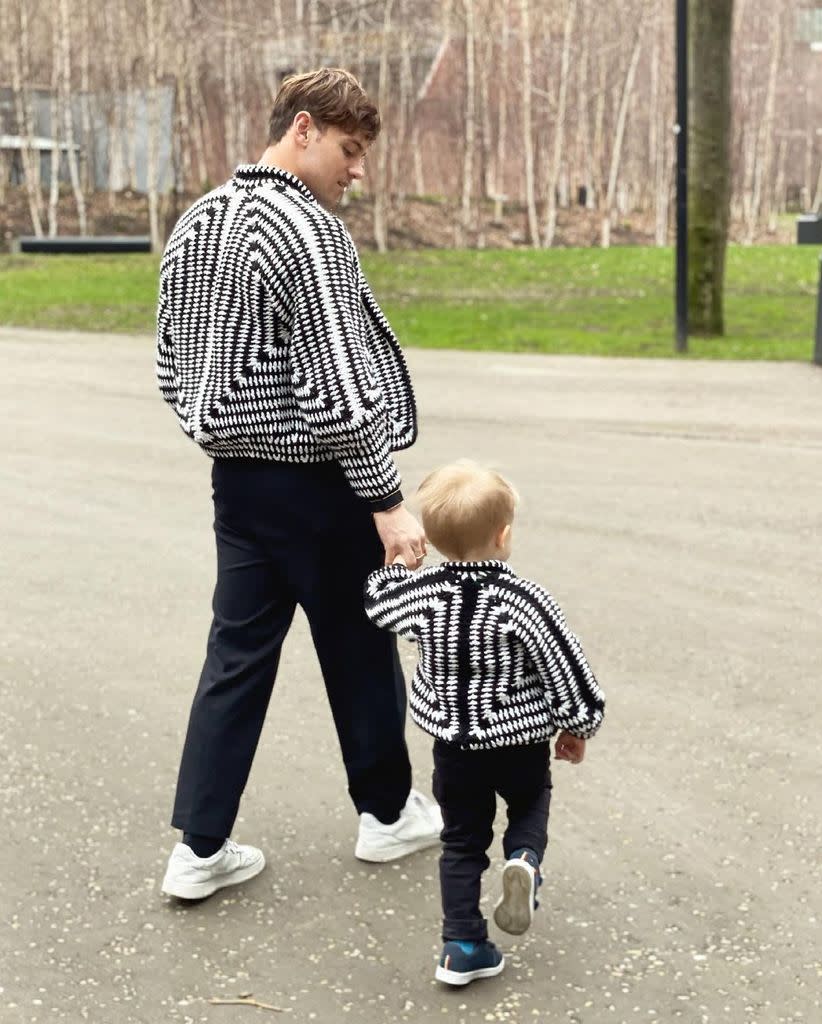 Tom Daley walks hand-in-hand with his toddler son Robbie