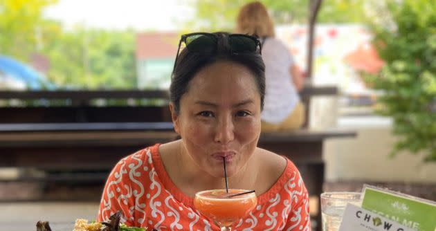 The author wearing her orange shirt during the weekend of the stakeout that never happened. (Photo: Courtesy of Sarah Paik)