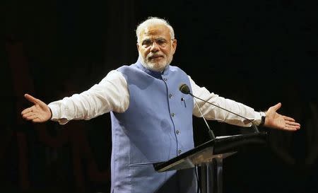 India's Prime Minister Narendra Modi reacts as he speaks to members of the Australian-Indian community during a reception at the Allphones Arena located at Sydney Olympic Park in western Sydney November 17, 2014. REUTERS/Rick Stevens