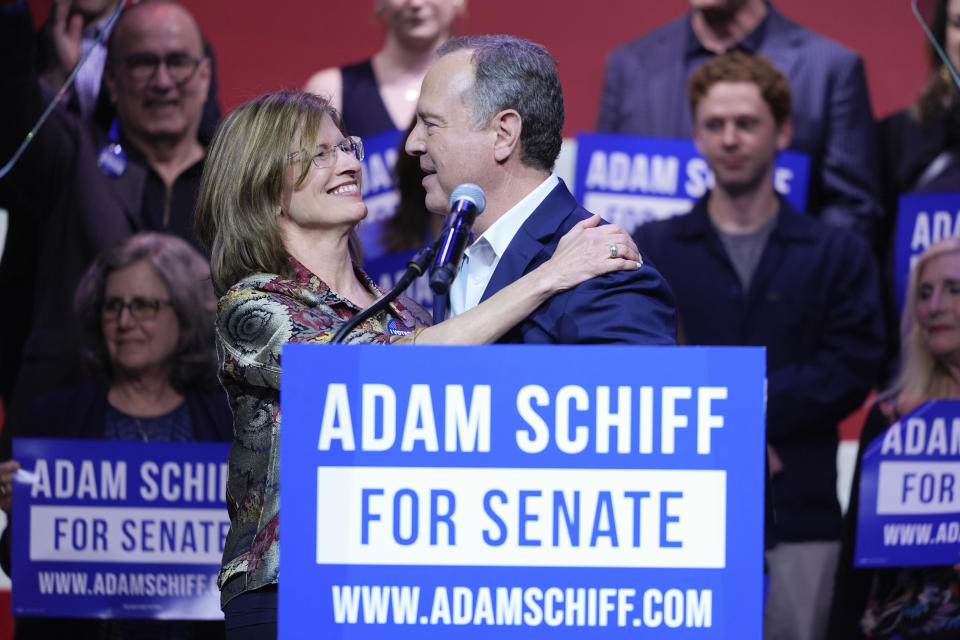 U.S. Rep. Adam Schiff, D-Calif., a U.S. Senate candidate, right, hugs his wife Eve at an election night party, Tuesday, March 5, 2024, in Los Angeles. (AP Photo/Jae C. Hong)